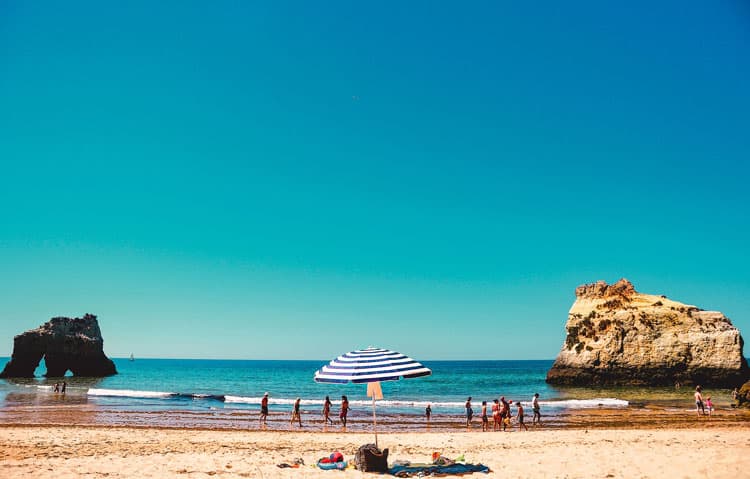 Sunny Praia Do Camilo beach in Portugal