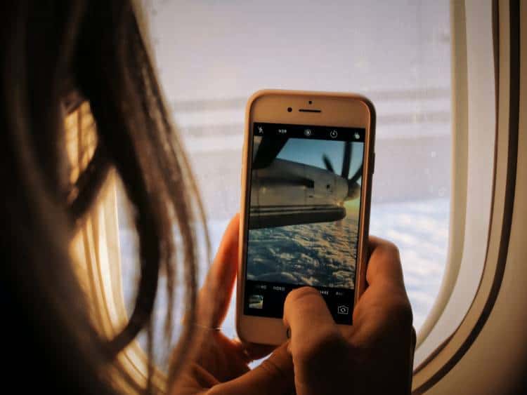 Living in a digital world. Traveling again by airplane. Photo by Patrick Tomasso