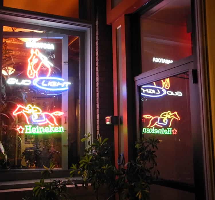 Restaurant windows lit with horse and jockey lights