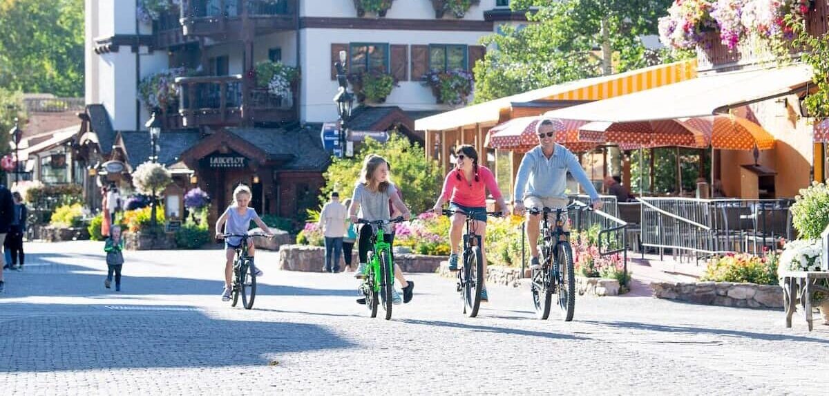 Family Biking in Vail Village by Jack Affleck