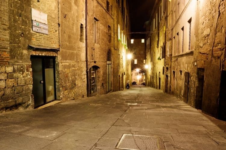 Studying abroad in Italy Siena streets at night canva