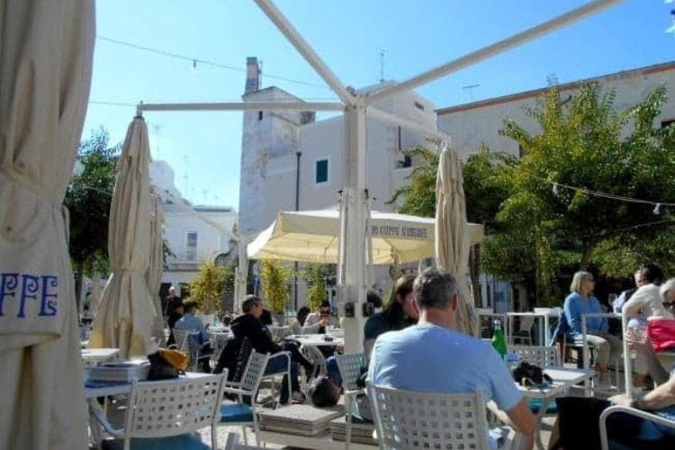Outdoor cafes are popular in Monopoli’s piazza