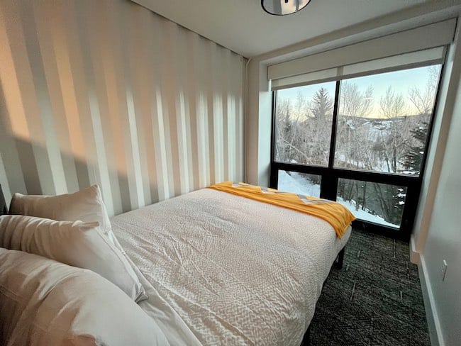 Comfy queen bed with a view.