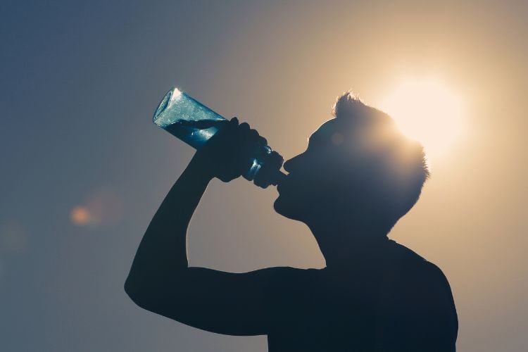 man drinking water
