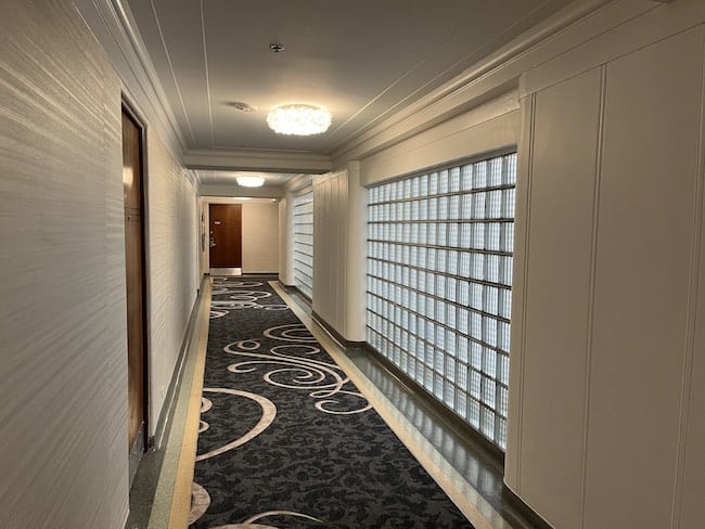 Eighth-floor hallway with glass block wall leftover from the 30s. Photo by Claudia Carbone