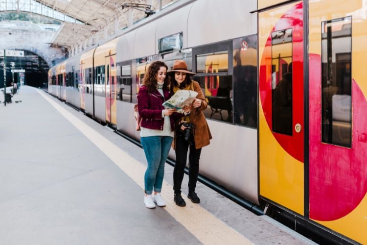 2 people boarding a train in Europe