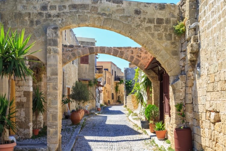 Historical streets of Rhodes' old town. Photo by Muratani from Getty Images via Canva