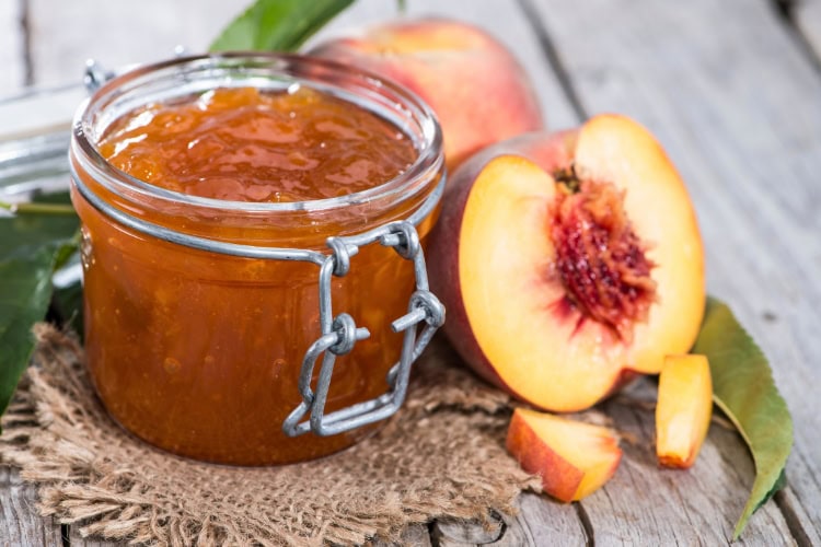 Local peach preserves. Photo by HandmadePictures from Getty Images via Canva