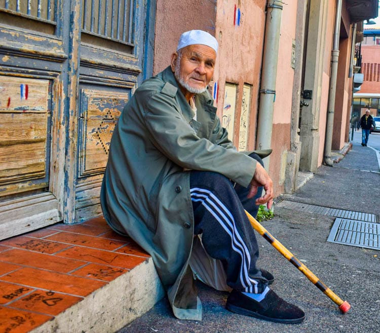 A North African man taking a rest in Quartier St. Jacques