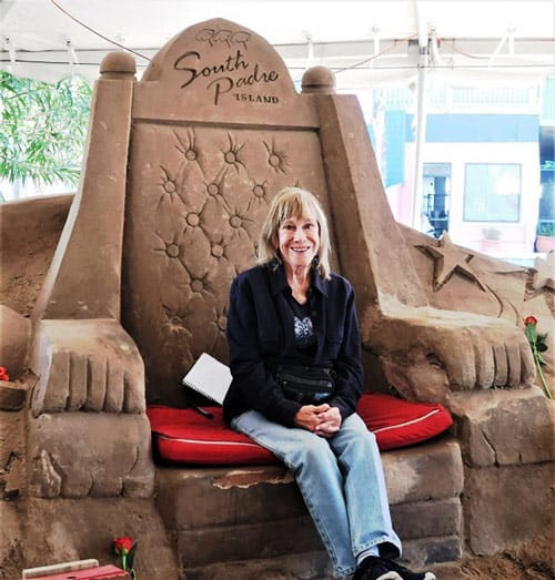 The author astride the throne at South Padre Island’s Sandcastle Village. Photo by Victor Block