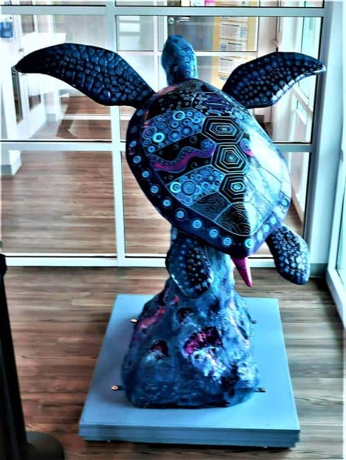 The sea turtle Indigo, on SPI’s Art Trail, beautifully reflects the area’s surrounding waters. Photo by Victor Block