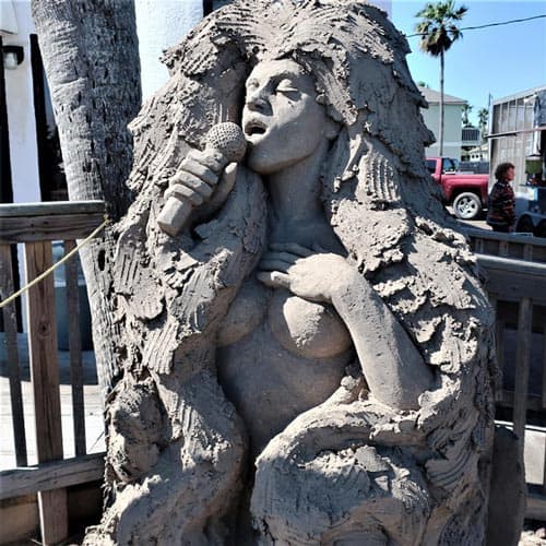 The risqué lounge singer sand sculpture is one of South Padre Island’s favorite. Photo by Victor Block