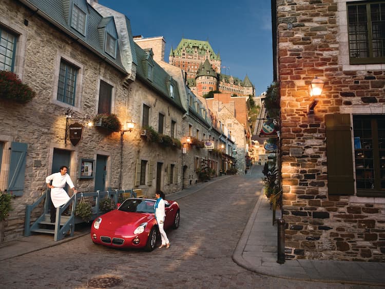 From nearly all points in the lower city, a view of the Chateau Frontenac hovering on the cliff above can be seen. Photo by Camirand Photo