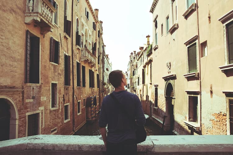 Man exploring Venice. Photo by Joshua Earle