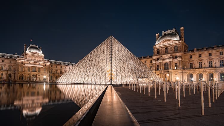 Musée du Louvre by night. Photo by Michael Fousert
