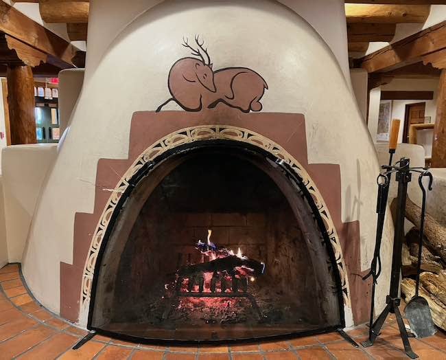 Kiva fireplace in the lobby of Hotel Santa Fe. Photo by Claudia Carbone