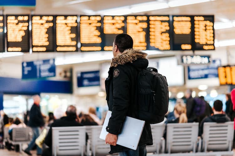 Traveler looking at announcements. Photo by Anete Lūsiņa