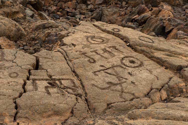 Petroglyph rock carvings serve as reminders of Hawai’i Island’s ancient civilization. Photo by Victor Block