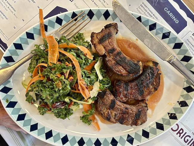 Pork Chops with applesauce and Kale salad. Photo by Claudia Carbone