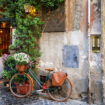 Bike learning against a wall in a scenic photo of Rome