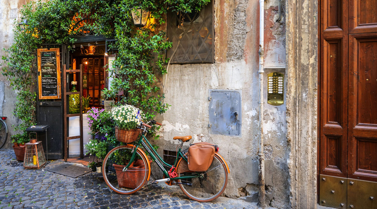 Bike learning against a wall in a scenic photo of Rome