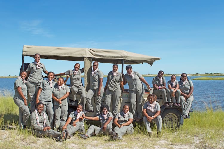 Chobe Angels group photo with Chobe River in the background. Photo courtesy of Chobe Game Lodge