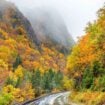 New Hampshire's winding mountain roads offer just a taste of the spectacular fall colors waiting along this 13-stop trail from Maine to Tennessee. Photo by DenisTangneyJr from Getty Images Signature via Canva