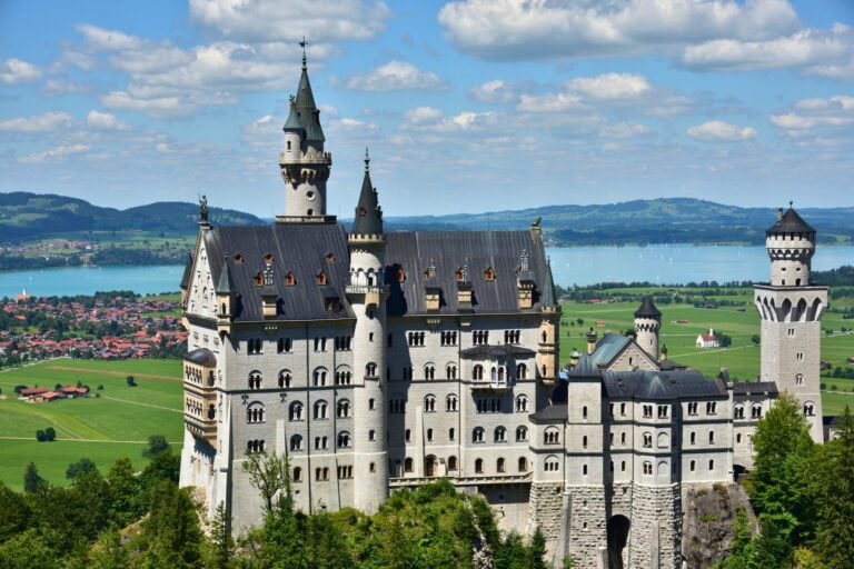 The Neuschwanstein Castle that inspired Disney, an iconic stop along the Rainbow Road train route. Photo by Aflo Images via Canva