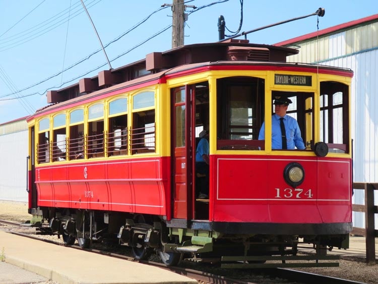 an electric-powered red trolley making its rounds