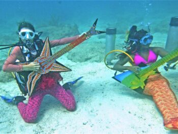 Mermaids “playing” instruments at the Underwater Music Festival in the Florida Keys. Photo by Mike Papish