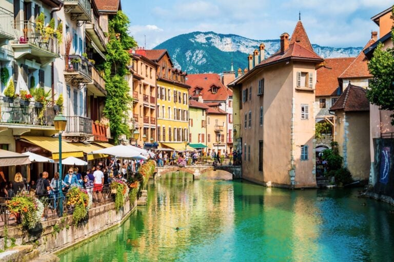 Annecyโs medieval village charms with colorful houses reflected in the calm, emerald canalsโan inviting spot to explore and unwind. Photogilio via iStock