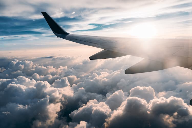 Flight in the clouds. Photo by Jerry Zhang, Unsplash