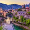 The Neretva river winding through the old UNESCO listed, Mostar bridge in Bosnia and Herzegovina, iStock, Pinterest