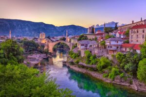 The Neretva river winding through the old UNESCO listed, Mostar bridge in Bosnia and Herzegovina, iStock