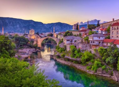 The Neretva river winding through the old UNESCO listed, Mostar bridge in Bosnia and Herzegovina, iStock