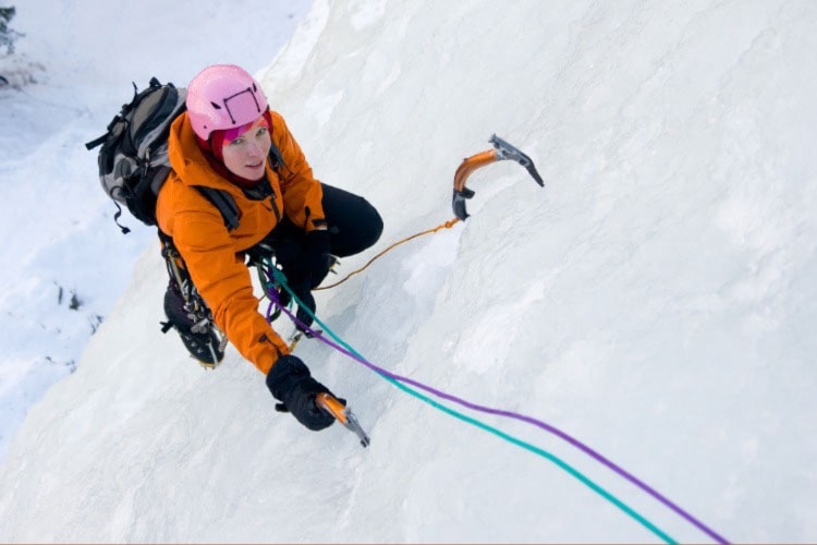 Scaling an ice wall is hard work. Photo by Mcech/Dreamstime