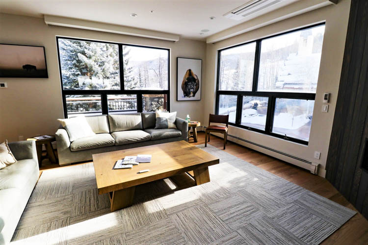 Living area offers views of slopes. At night, guests can watch snowcats grooming the trails for the following day