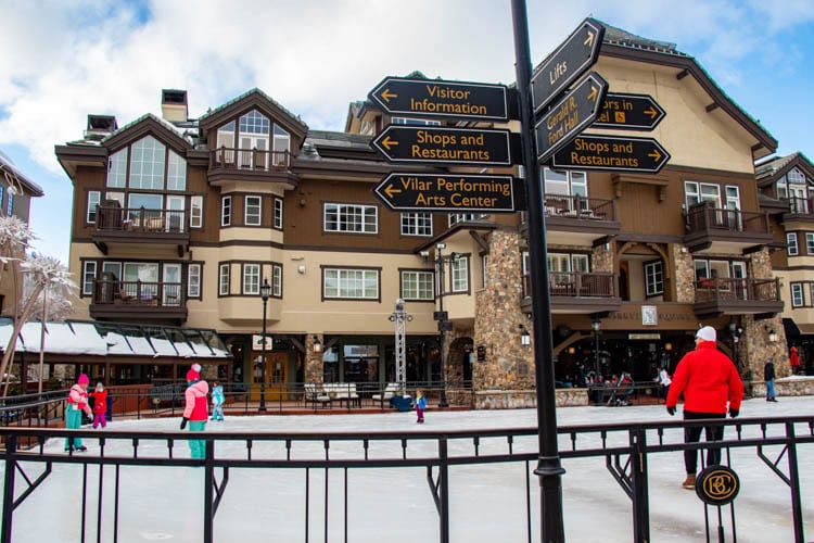 Skaters glide on the rink in the center of Beaver Creek Village