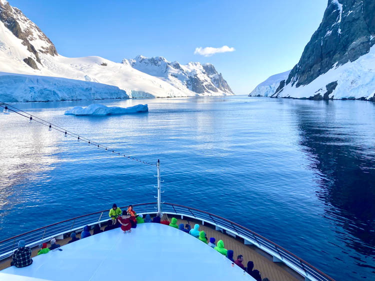 Antarctica cruise Narrow stretch of Lemaire Channel with passengers