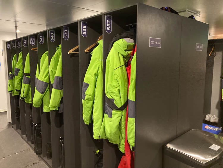 Parkas and boots in the mud room