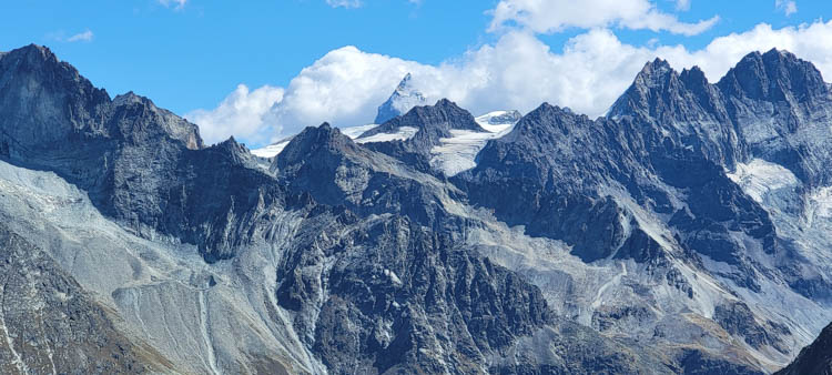 Haute Route First glimpse of the Matterhorn, center of pic, from Col de Reidmatten