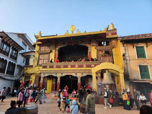 A monastery at Boudha Stupa allows visitors to walk up to the second and third floor balconies for views of the stupa. 