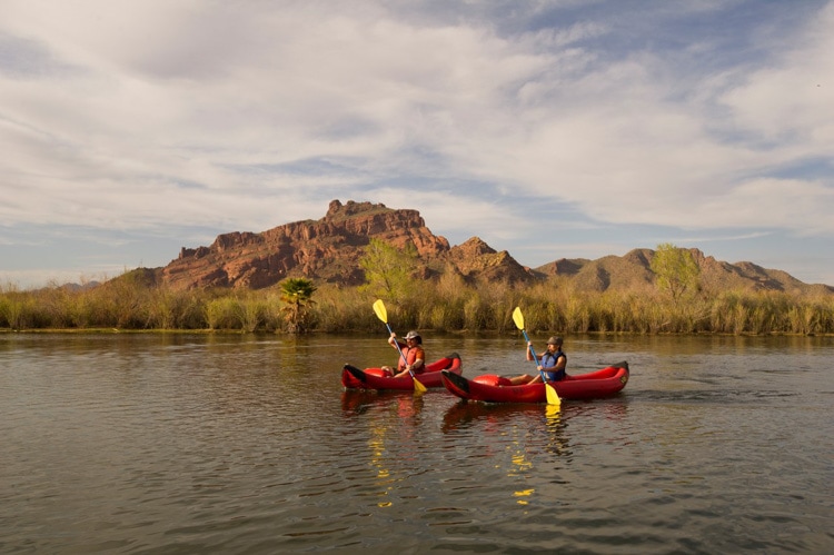 Couple Kayaking with REI Co-op Experiences. Credit REI Co-op Experiences