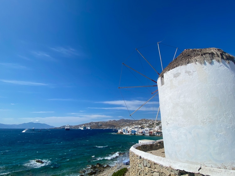 The windmills overlooking Mykonos' harbour provide a beautiful overview of the town below. 
