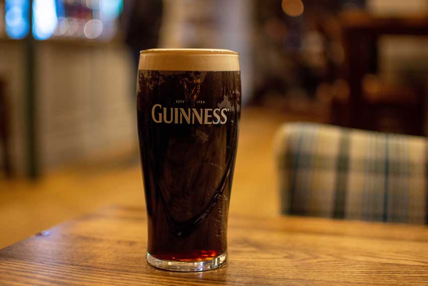 Guinnes beer at an Irish Pub. Photo by Unsplash