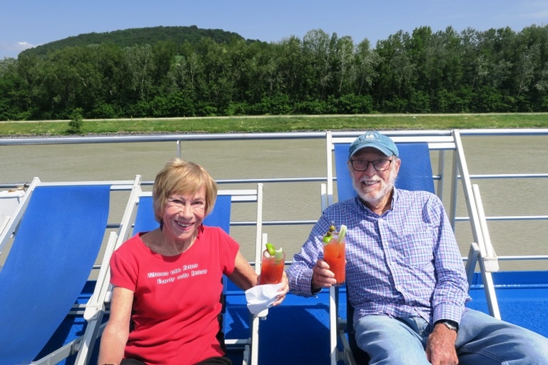 Authors relaxing on the ship’s deck during Grand Circle’s Danube River Cruise. Photo by Fyllis Hockman