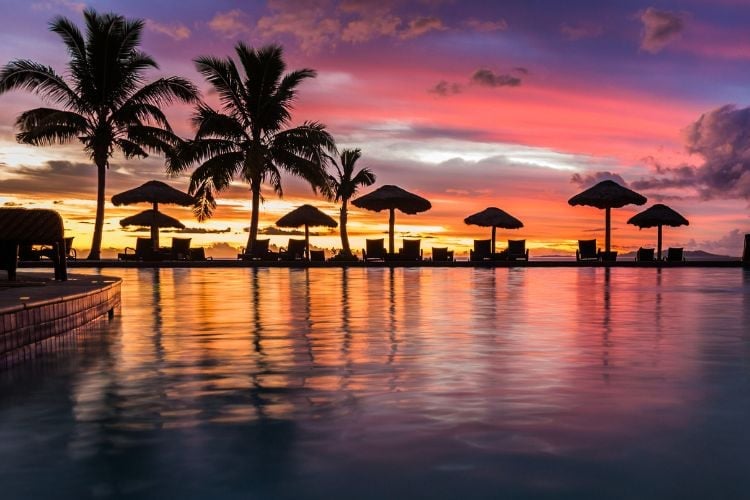 Colorful sunset over a pool in Fiji