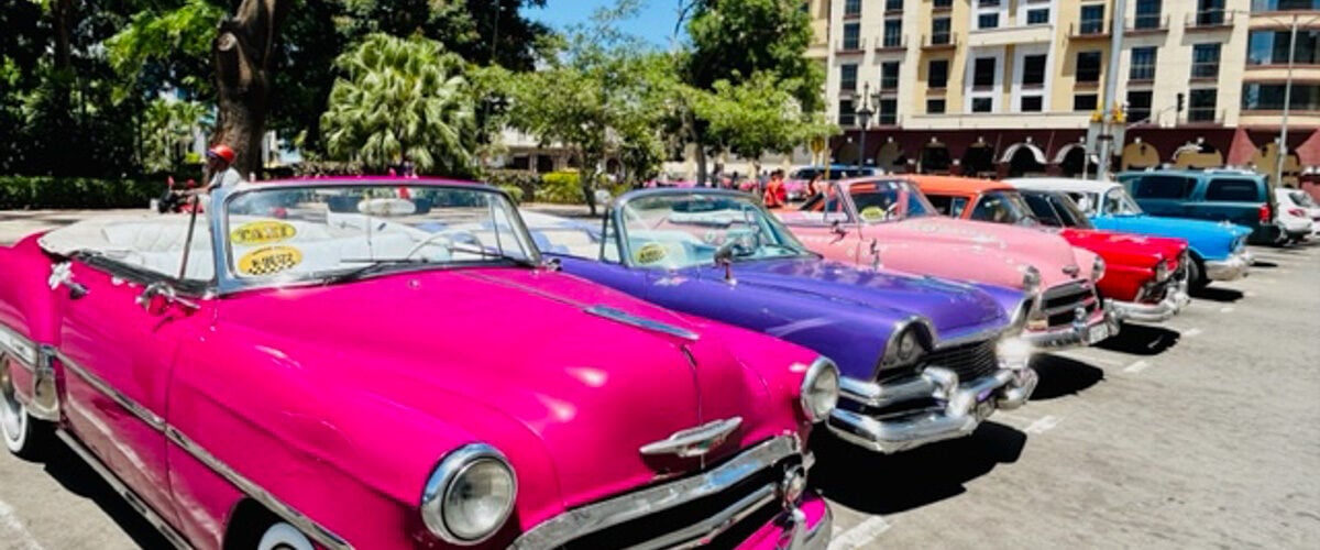 Havana Cuba Gran Hotel Manzana colorful cars