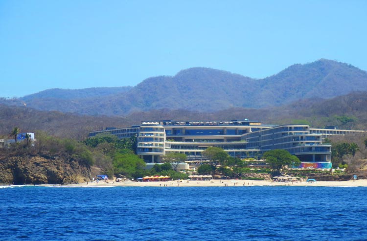 Secrets Bahia Mita Surf & Spa Resort and its sister property Dreams with mountains in the background face the Pacific in Nayarit State, Mexico