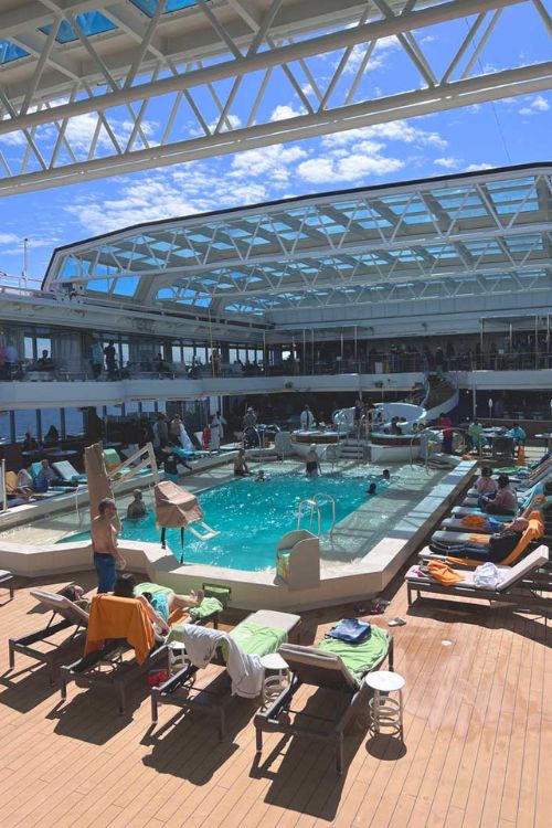 Sunbathing at the ship's pool with an open roof
